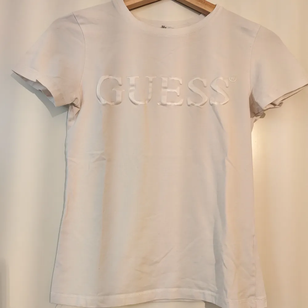White T-Shirt. Used occasionally. It has some small imperfections, hence the price.. T-shirts.