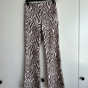 Zebra pants - Perfect party pants. Stretchy zebra pattern in white and maroon (Taylor’s version). 