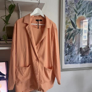 Kavaj large korall orange  - Kavaj i polyester- storlek L - korall/pastell orange 
