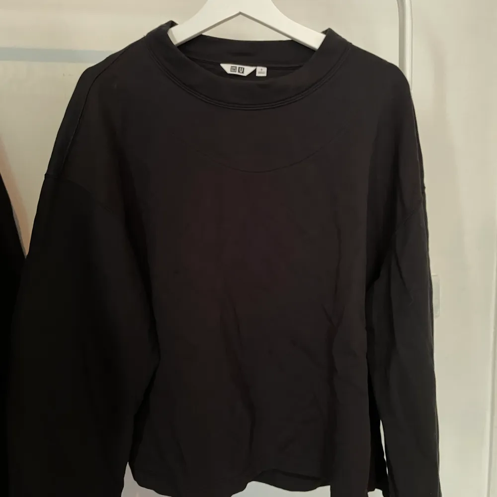 A boxy black sweatahirt from Uniqlo. Condition: New- never worn. Size: S. Hoodies.