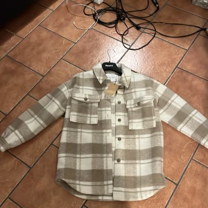 Helt ny kappa - Helt oanvänd, lappen är kvar