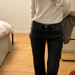 Levi’s jeans - Black, slightly baggy, low rise jeans. These jeans are extremely flattering. These jeans have barely been worn and the price originally was in the 1000s.