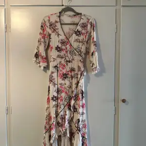 Long flower dress with belt. Used a few times , good condition 