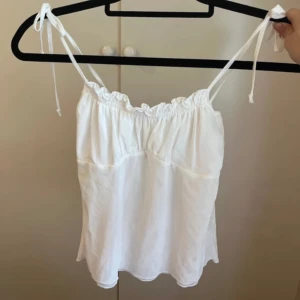 Topp från Brandy Melville - Helt oanvänd, prislapp kvar. Storlek XS. Topp från Brandy Melville. 