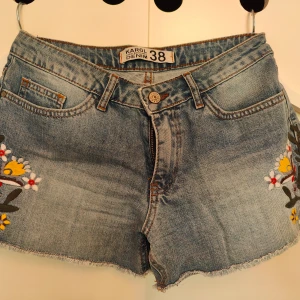 Denim shorts  - Very good condition  Flower figures on the sides