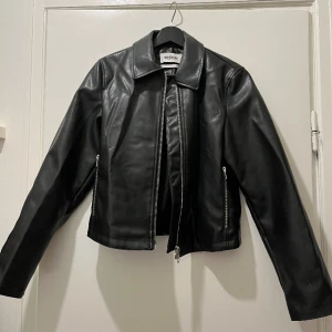 Leather Jacket - Leather jacket in the softest faux leather. Really nice silver detailing in the zippers. Fits anyone from size 32-38. Never used!