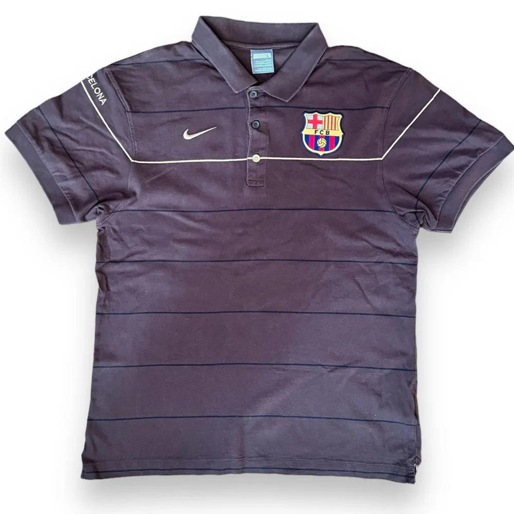 Nike Barcelona Polo  Size: L (fits M)  Great Condition   Measurements Top: Width: 49cm Length: 67cm. T-shirts.