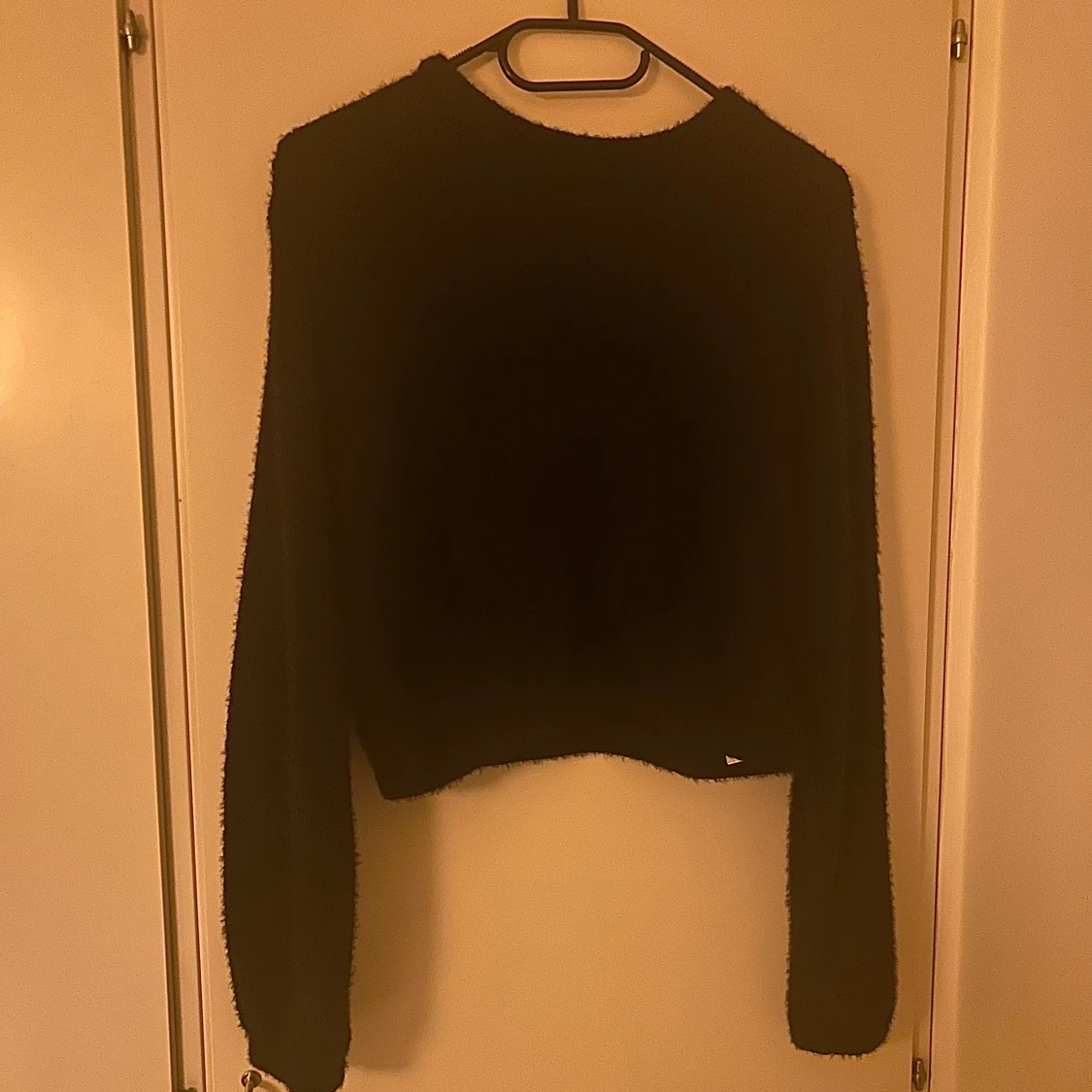 Svart stickad tröja