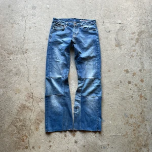 Reconstructed Flare Jeans - These jeans has been reconstructed to have a skinny flared fit with distressed details.