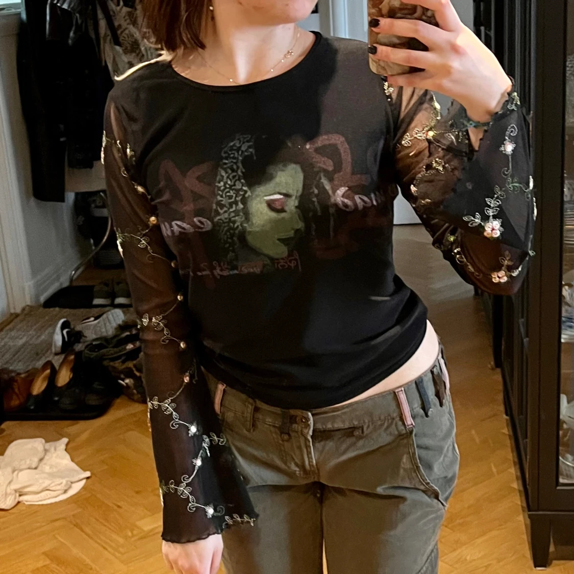 Topp med mesh ärmar