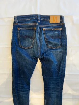 Nudie Skinny Lin Jeans Blue Men's - Begagnade blå Nudie Skinny Lin-jeans i smal passform.