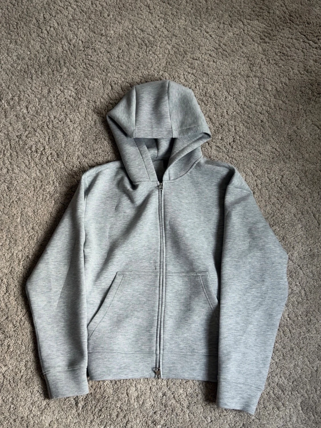 Kvalité Ljusgrå zip hoodie.
