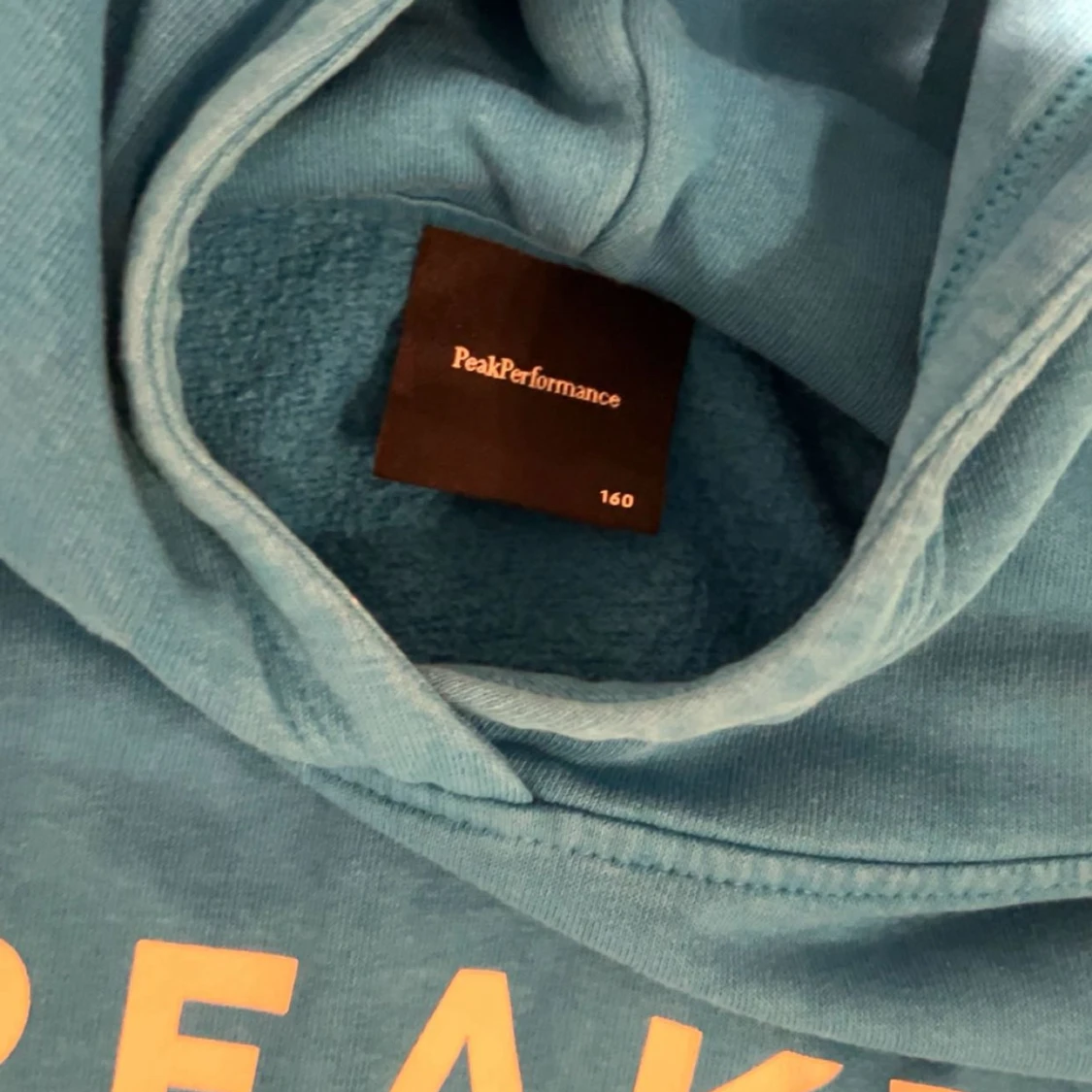 Blå hoodie från Peak Performance - 1
