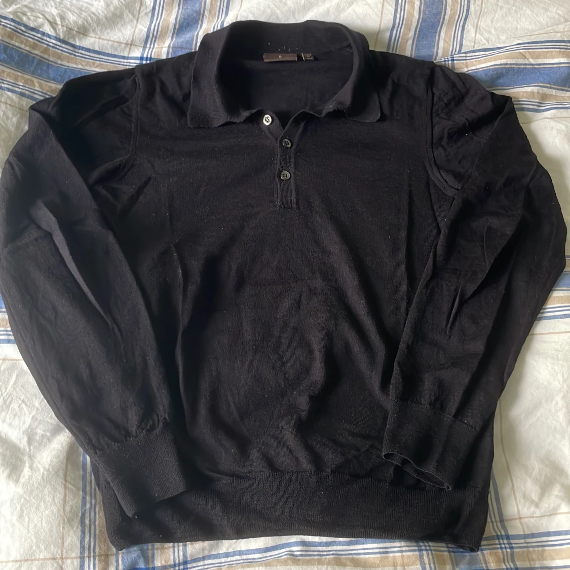 Blå pikétröja från Oscar Jacobson