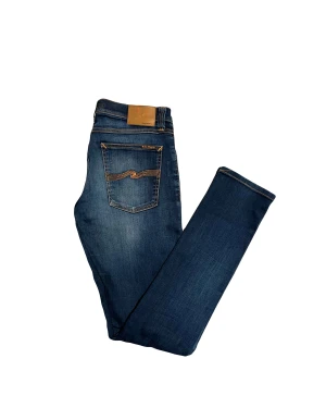Nudie jeans - Snygga blå jeans från Nudie Jeans. Riktigt skön tvätt. Modell Long Tight John. Storlek W31 L34. Tveka inte att höra av vid frågor!