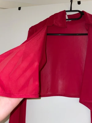 Topp - Tröja med snörning från Nelly aldrig använd.