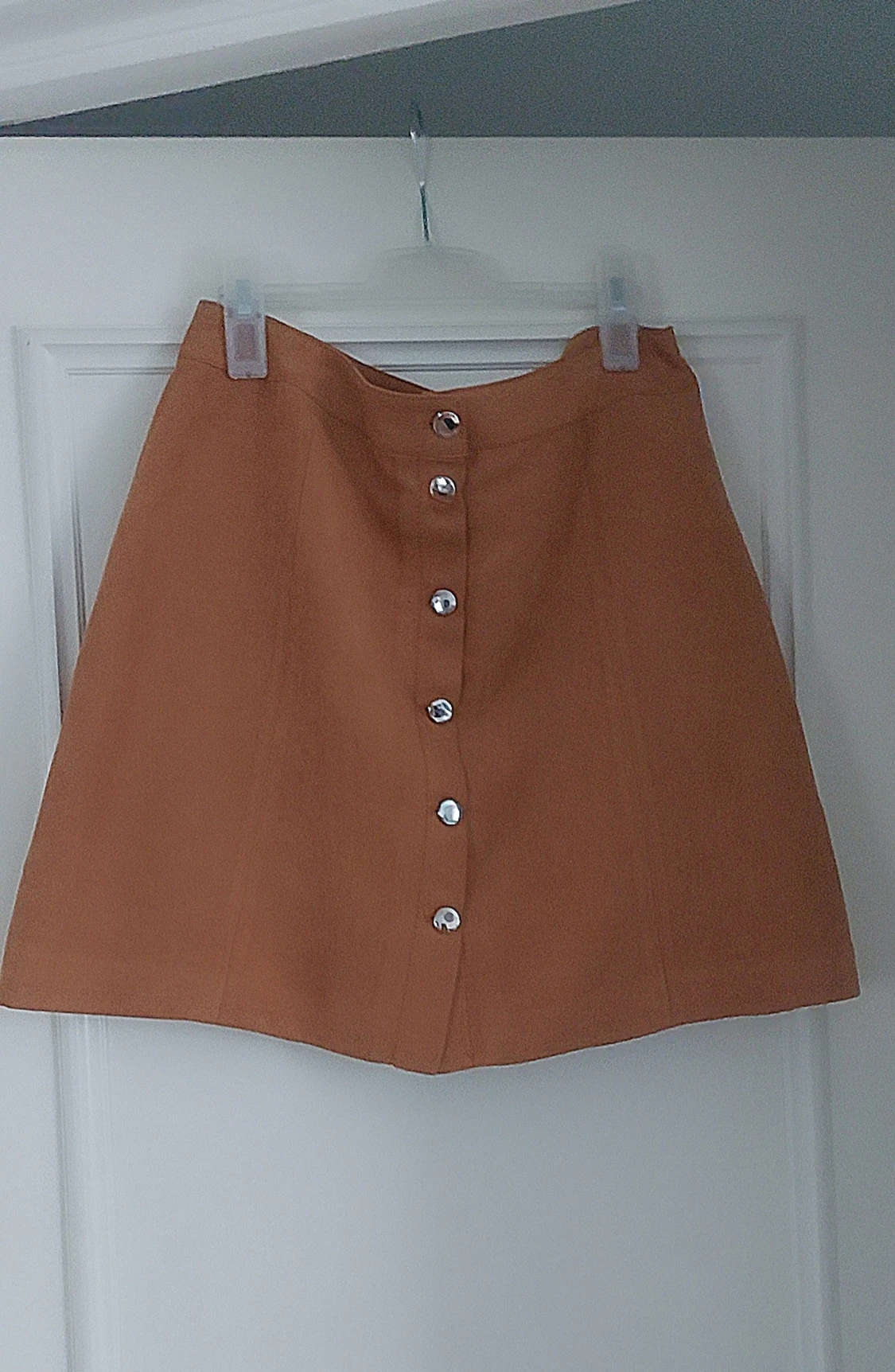 Brun mockakjol med knappar från H&M