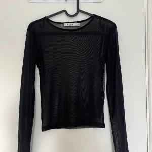 Svart topp i mesh - Endast använd en gång