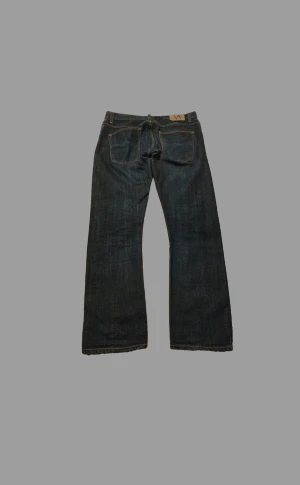 Nudie grim tim selvedge jeans - ✅Feta Nudie ”grim tims” som är open dry selvedge i storlek 34/32!✅ 🍀100% bomull🍀🤑Riktigt fin kvalitet och skick på dessa jeans, skriv privat för fler frågor/funderingar samt för fler bilder🤑 (kan tänka att sänka priset vid snabb affär)