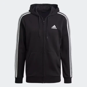 Svart Adidas hoodie med dragkedja - Svart Adidas huvtröja med dragkedja och vita ränder på ärmarna. Adidas loggan finns på bröstet..