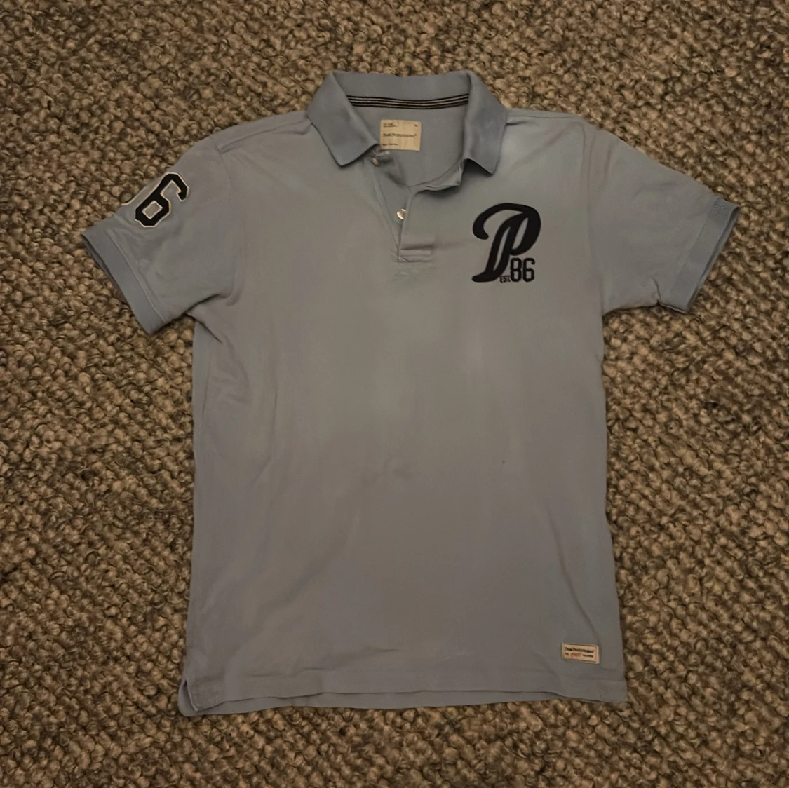 Ljusblå vintage pikétröja Peak Performance M