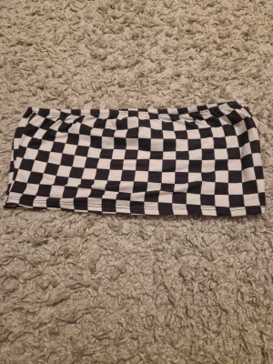 Checker topp - Använd fåtal gånger, svart vit checker topp storlek S