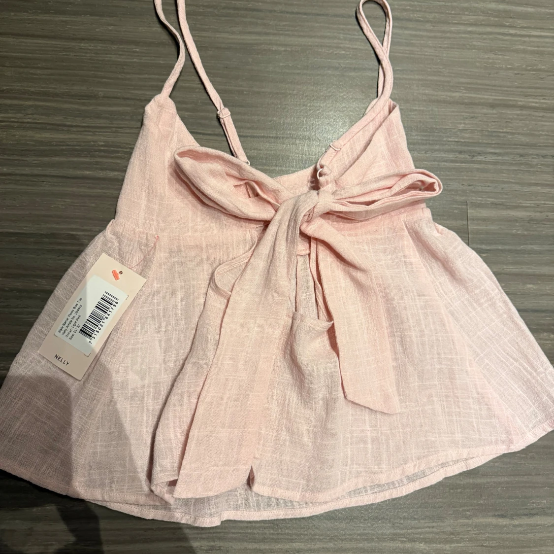 Ljusrosa linnetopp med rosett från Nelly - 1