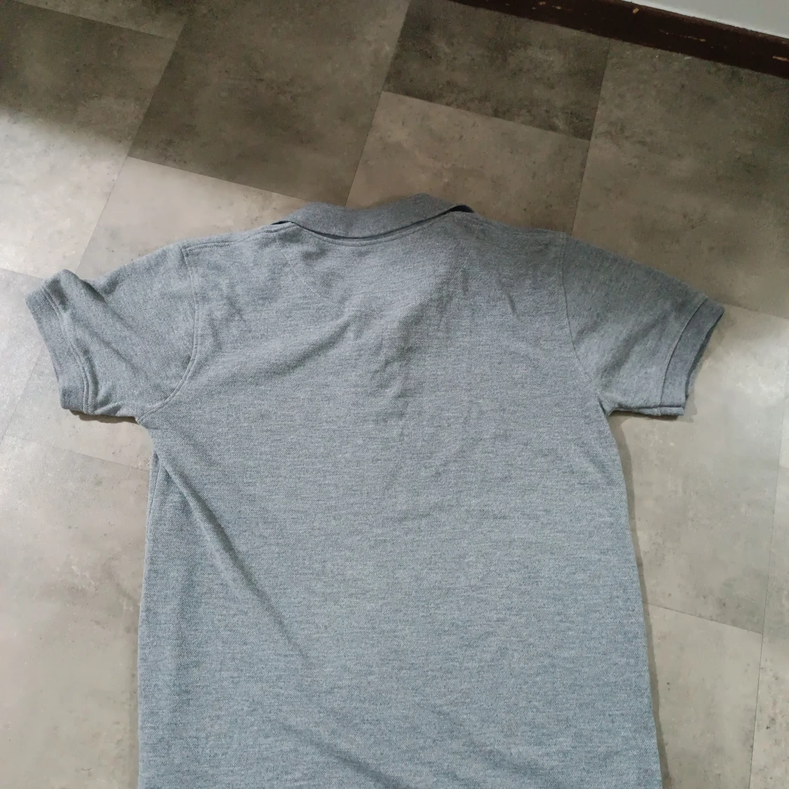 Grå pikétröja från Lacoste - 1