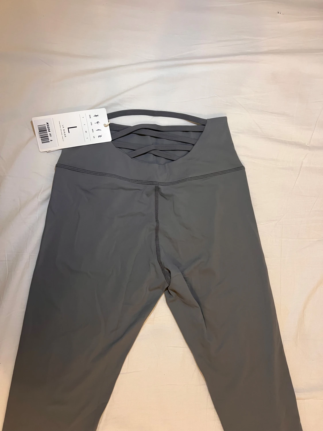 Grå leggings med korsade band