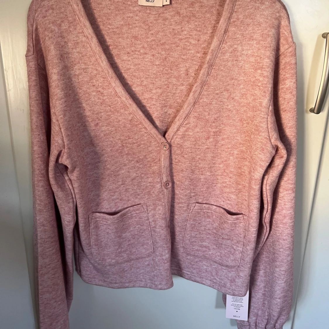 Ljusrosa kofta från Nelly, storlek S