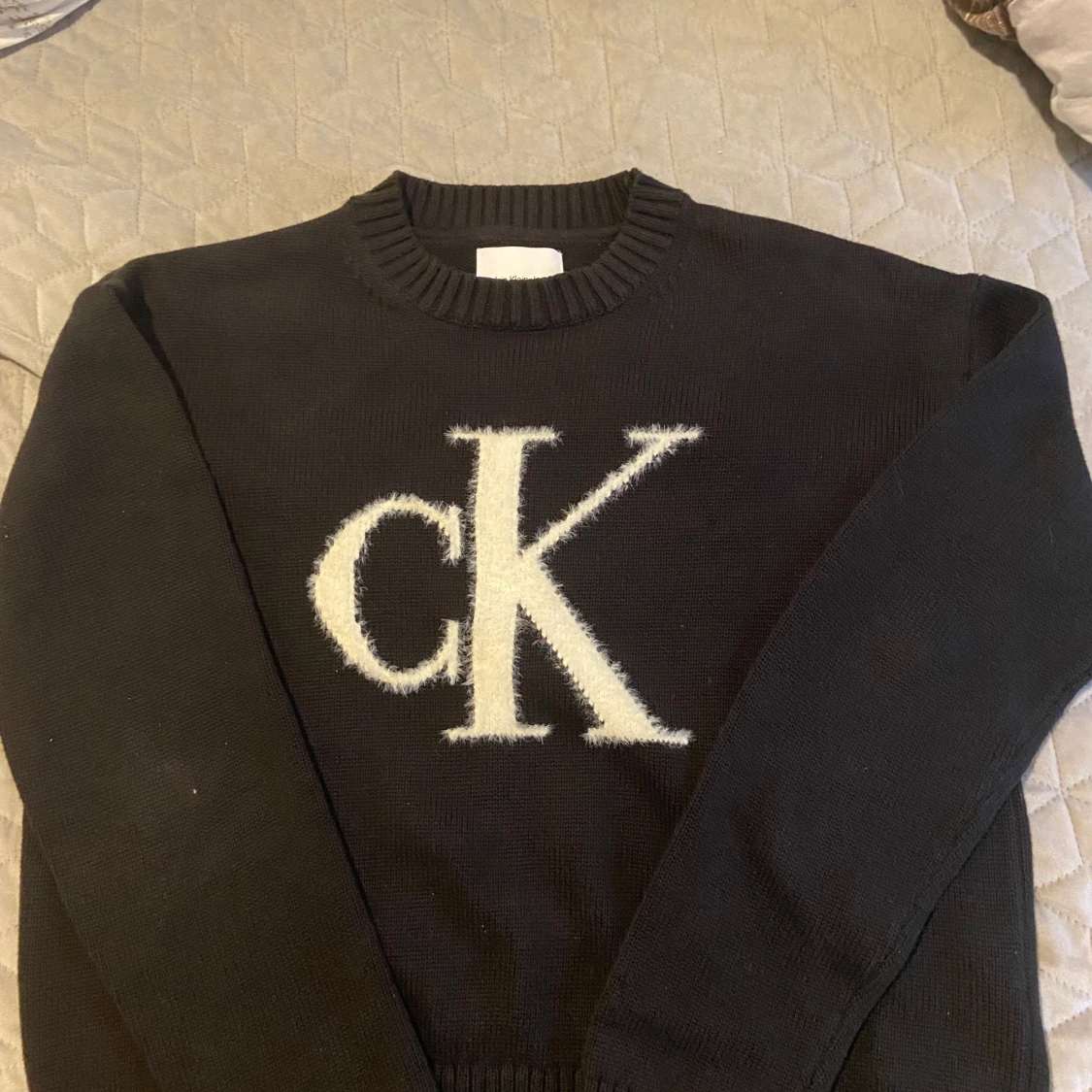 Svart stickad tröja från Calvin Klein XS