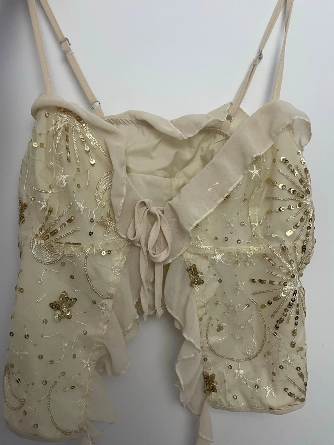 Beige bolerotopp med paljetter och snörning