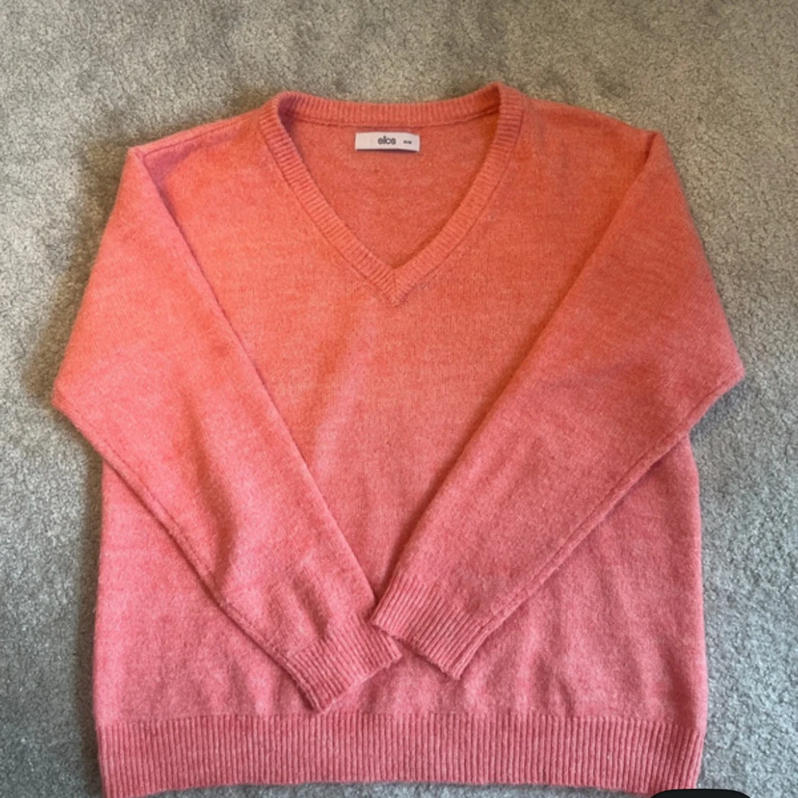 Orange rosa stickad tröja från ellos