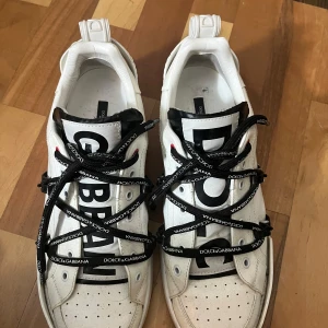 White Dolce & Gabbana portofino sneakers - It is in good condition but comes without a box.