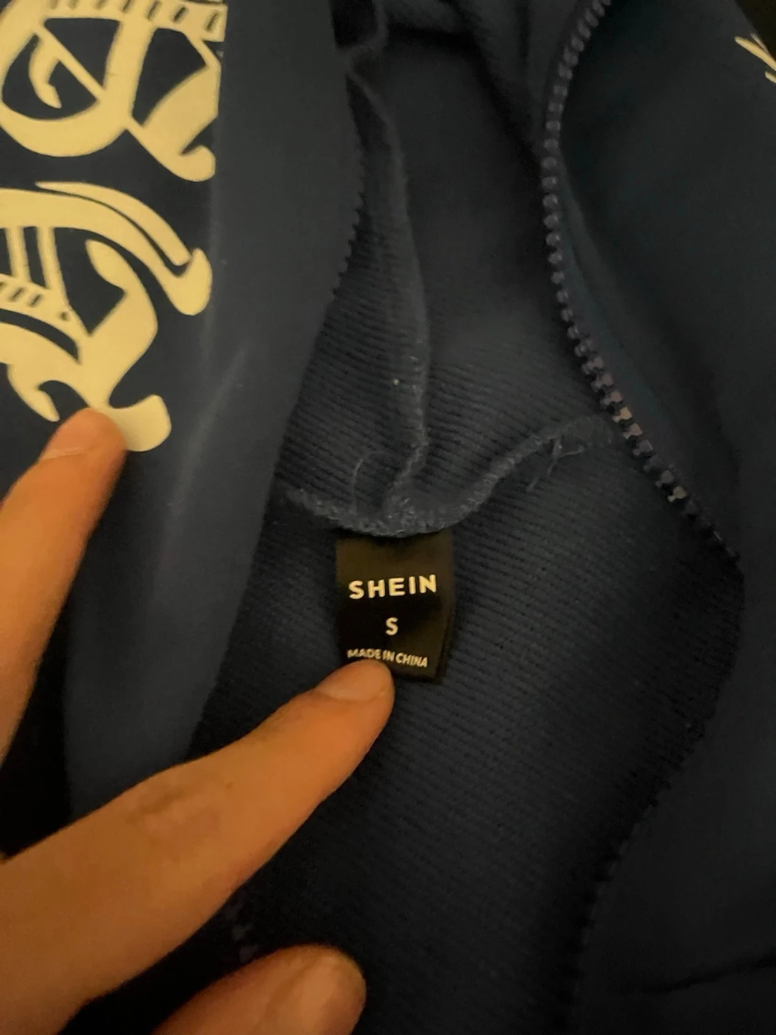 Blå hoodie med dragkedja hella väggen upp - 1