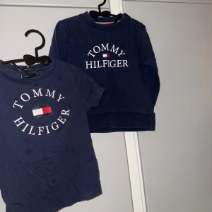 Tommy Hilfiger  - Snygga Tommy Hilfiger tröjor, Tshirt i 98 och finns små skavanker. Sweatshirt i 92 i superfint skick dock någon dov fläck jag inte sett så den är obehandlad.
