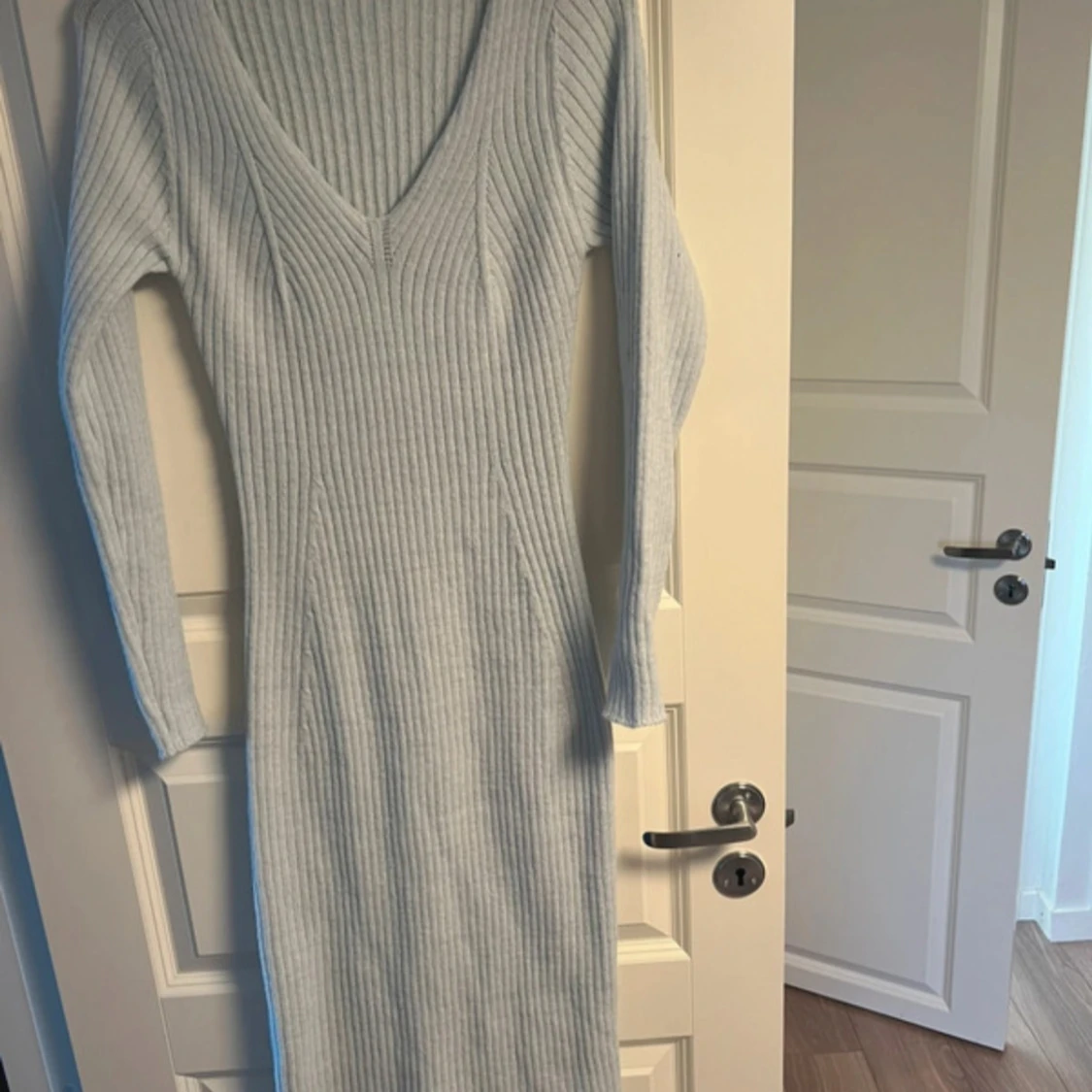 ljusblå stickad klänning storlek M