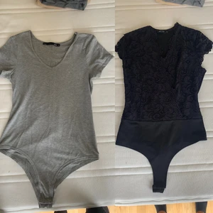 Body - Grå body i bomull, strl M. Svart body med spets, strl S. Bra skick, 150kr/st. Paketpris 200kr. Frakt tillkommer!