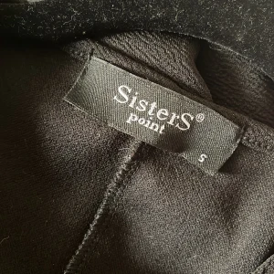 Kofta - Kofta perfekt att dra över en blus eller att knyta i midjan och använda som blus