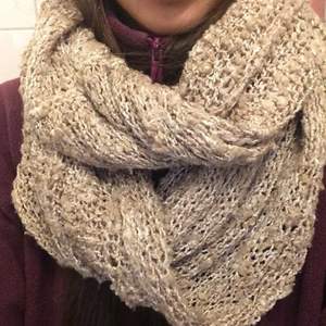 Warm scarf in beige color