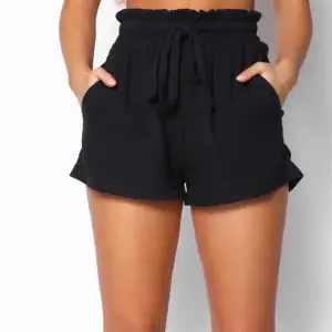 New black shorts from white fox boutique. Never used, still has tag on, high waisted, loose fit and comfortable, cotton material 