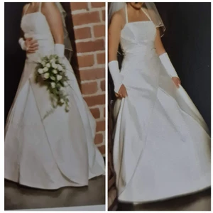 Brudklänning  - Säljer en vacker brudklänning med pärlor samt lång släp. Endast använd 1 gång och är kemtvättad. Behöver du prova? Hör av dig. Klänningen är i storlek 12 motsvarande 38.