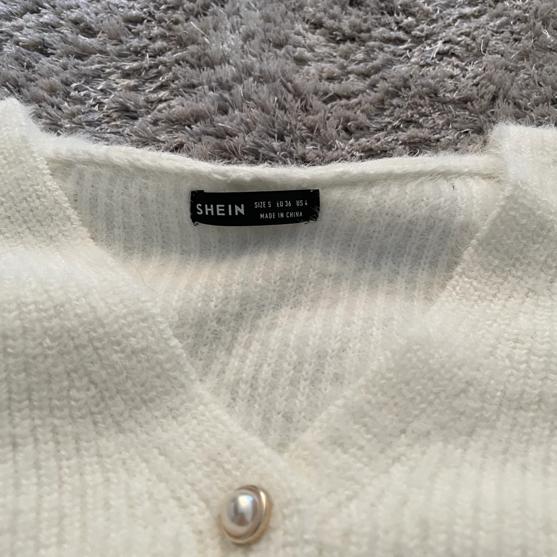 Kroppad stickad kofta - 90