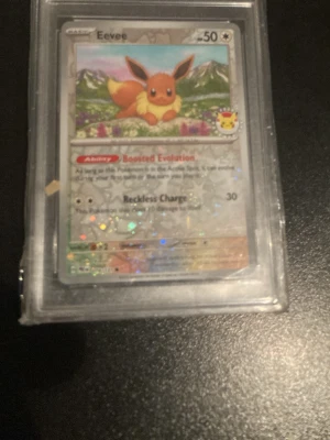 Eevee Cosmos Holo Pokémon Day Graderad - Enligt bild 