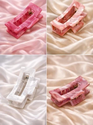 Rektangulära hårklämmor i pastell - Stilrena rektangulära hårklämmor i pastellfärger som rosa, ljusrosa och vit. Tillverkade i glansig akryl med marmorerad effekt. Perfekta för att skapa trendiga frisyrer och hålla håret på plats. Säljs utan synligt märke. Skriv privat för färg!