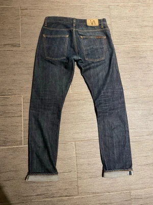 Nudie jeans Grim Tim dry selvage - Nudie jeans | Grim Tim | Open Dry Selvage         Size W31 L34 | Very nice fades | contact me for more info or photos! Come with offers! 