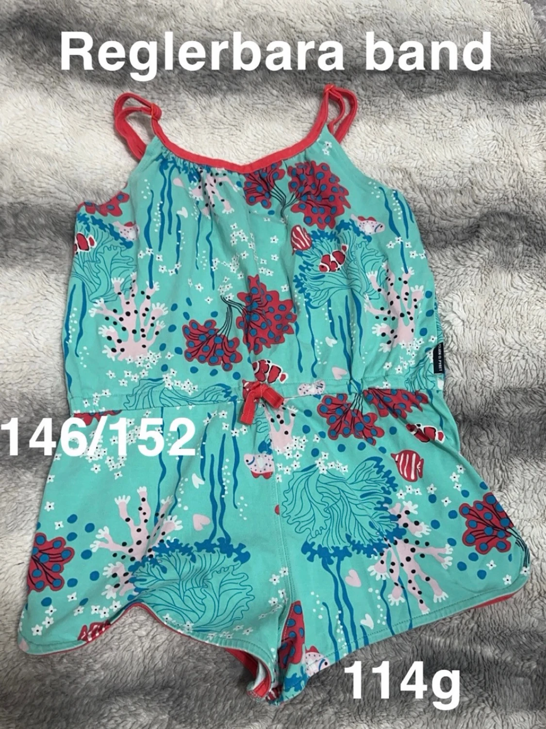 Turkos jumpsuit med havsmotiv