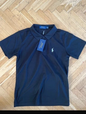 Svart pikétopp från Polo Ralph Lauren - svart pikétröja från Polo Ralph Lauren