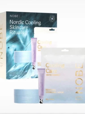 NOBE Nordic Cooling Skincare Kit - Säljer ett NOBE Nordic Cooling Skincare Rituals-kit med Cooling Care-produkter. Innehåller blå burk med De-Puffing Eye Patches (30 par), hydrogelmask och ögonkräm. Produkterna har en fräsch, ljusblå design och är perfekta för en uppfriskande hudvårdsrutin.