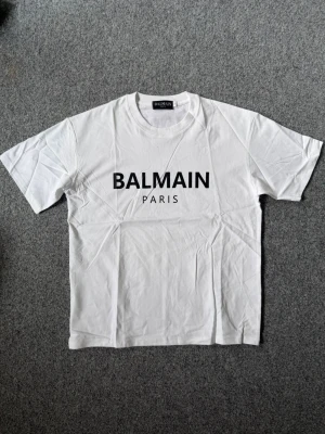 Balmain white t shirt - Size M, true to size. Unused, brand new and fresh. Please feel free to ask questions.